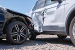 Damaged in heavy car accident vehicles after collision on city street crash site - how long after a car accident can you sue concept