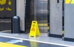 repair in progress sign near an elevator - types of premises liability claims concept